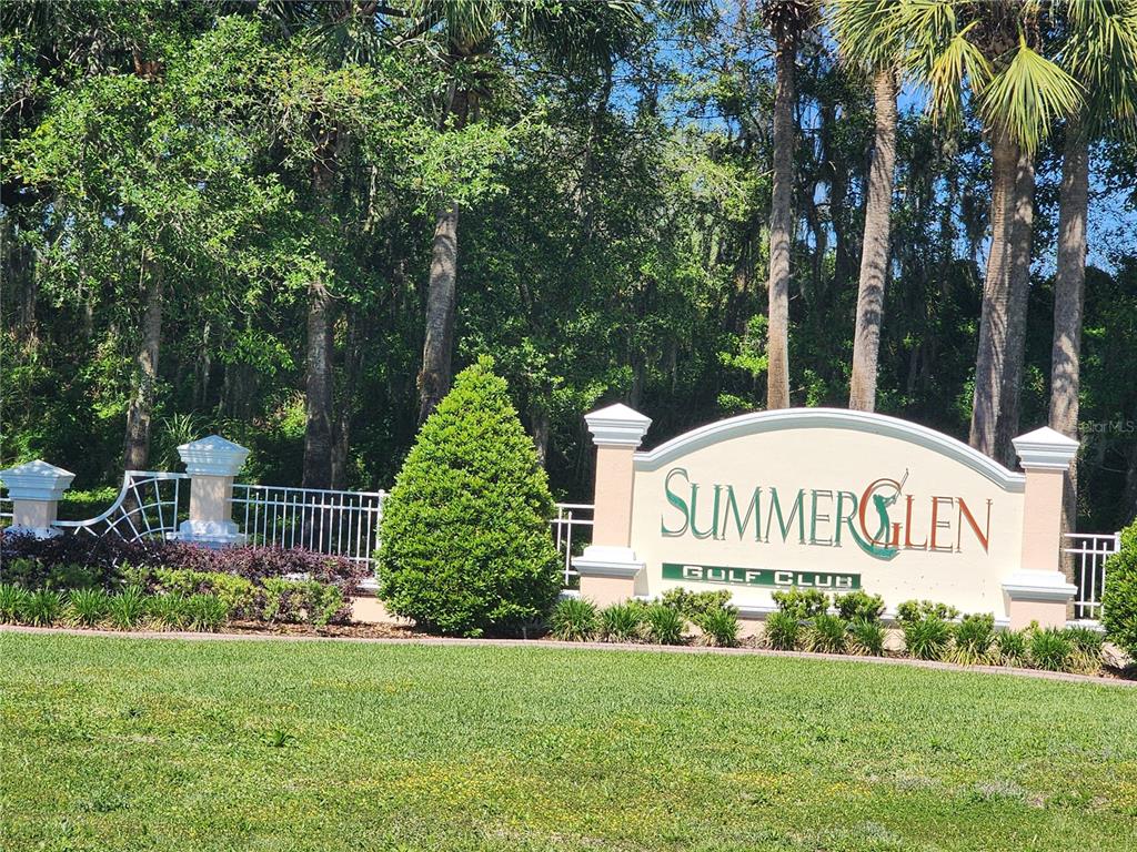 A sign for SummerGlen Golf Club stands in front of trees and a white fence — 1715 SW 157TH PLACE ROAD, OCALA, FL