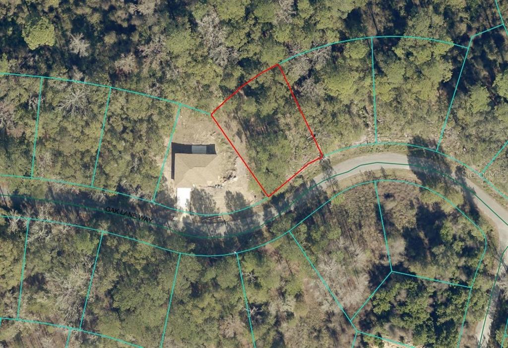 This is an aerial map showing a vacant lot outlined in red next to a house — OAK LANE WAY, OCALA, FL
