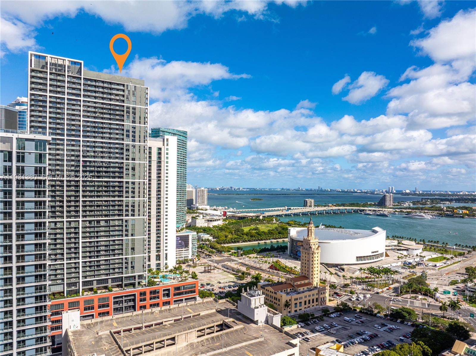 An aerial view shows a tall residential skyscraper in Miami near the Kaseya Center — 159 NE 6th St # 2608, Miami FL 33132, MIAMI, FL