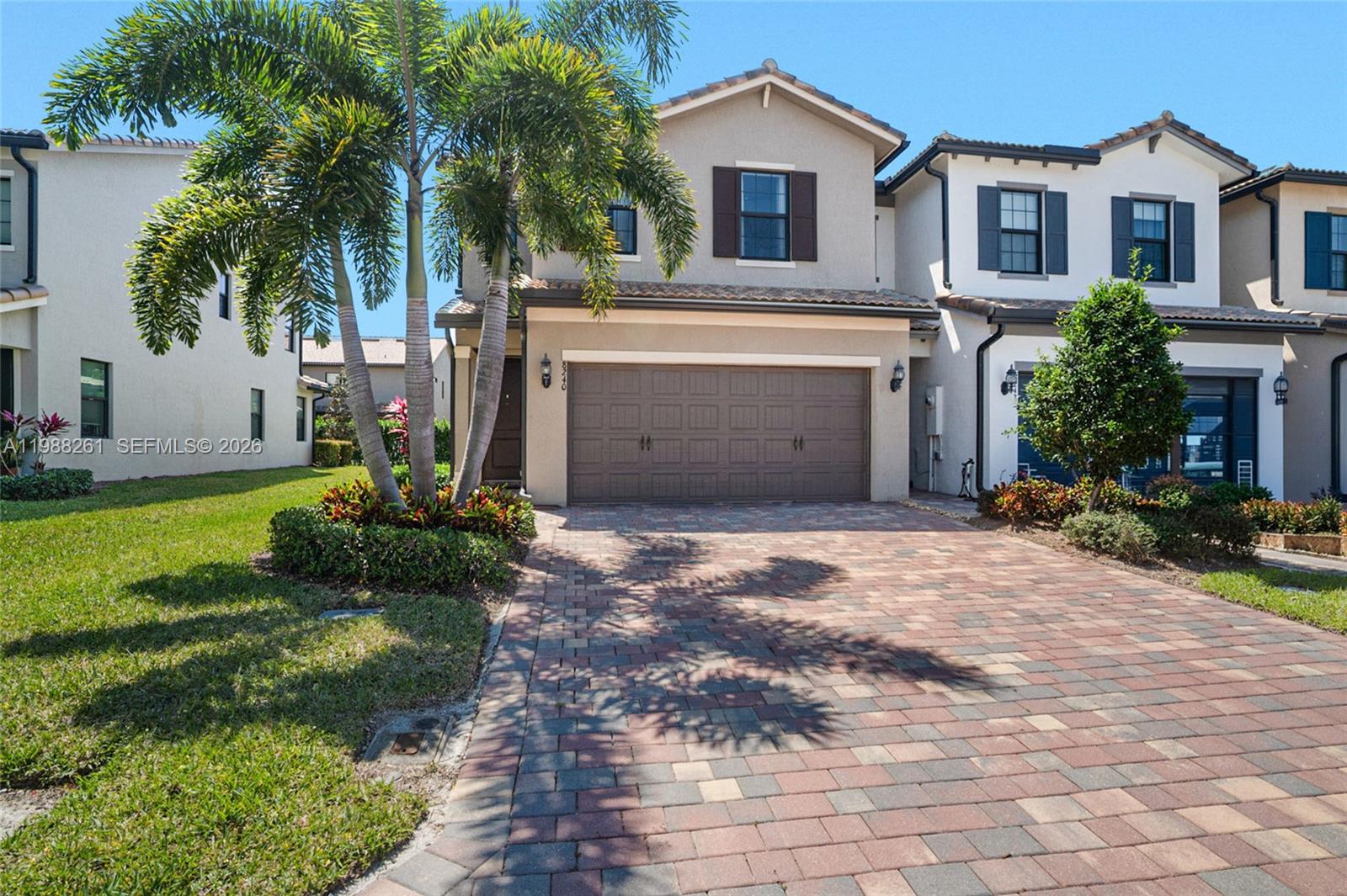 A stone monument sign for The Fields community stands in a landscaped lawn — 8240 Tailshot Ct, Lake Worth FL 33467, LAKE WORTH, FL