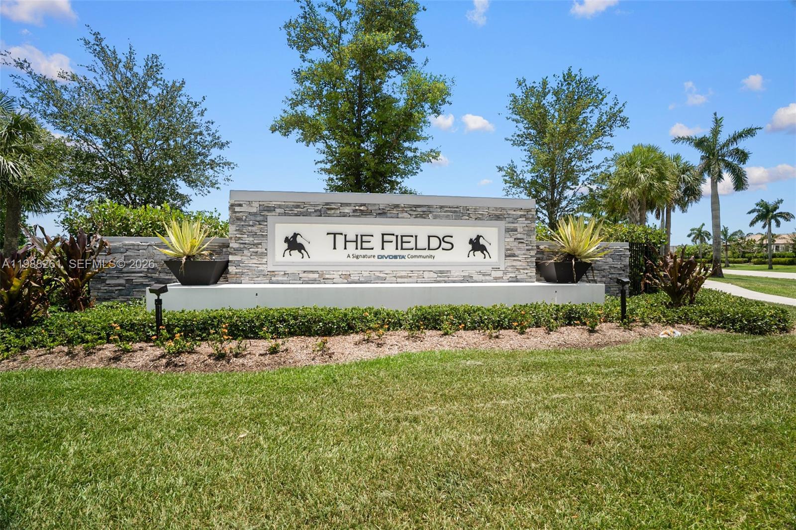 A two-story suburban house features a paved driveway, a two-car garage, and palm trees — 8240 Tailshot Ct, Lake Worth FL 33467, LAKE WORTH, FL