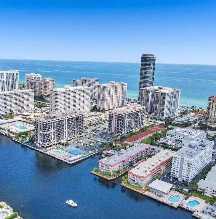 An aerial view of high-rise apartment buildings along a canal and the ocean coastline — 2097 S Ocean Dr # 305, Hallandale Beach FL 33009, HALLANDALE BEACH, FL
