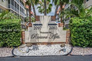 A sign for Riviera Apts stands between two apartment buildings with palm trees and landscaping — 2097 S Ocean Dr # 305, Hallandale Beach FL 33009, HALLANDALE BEACH, FL