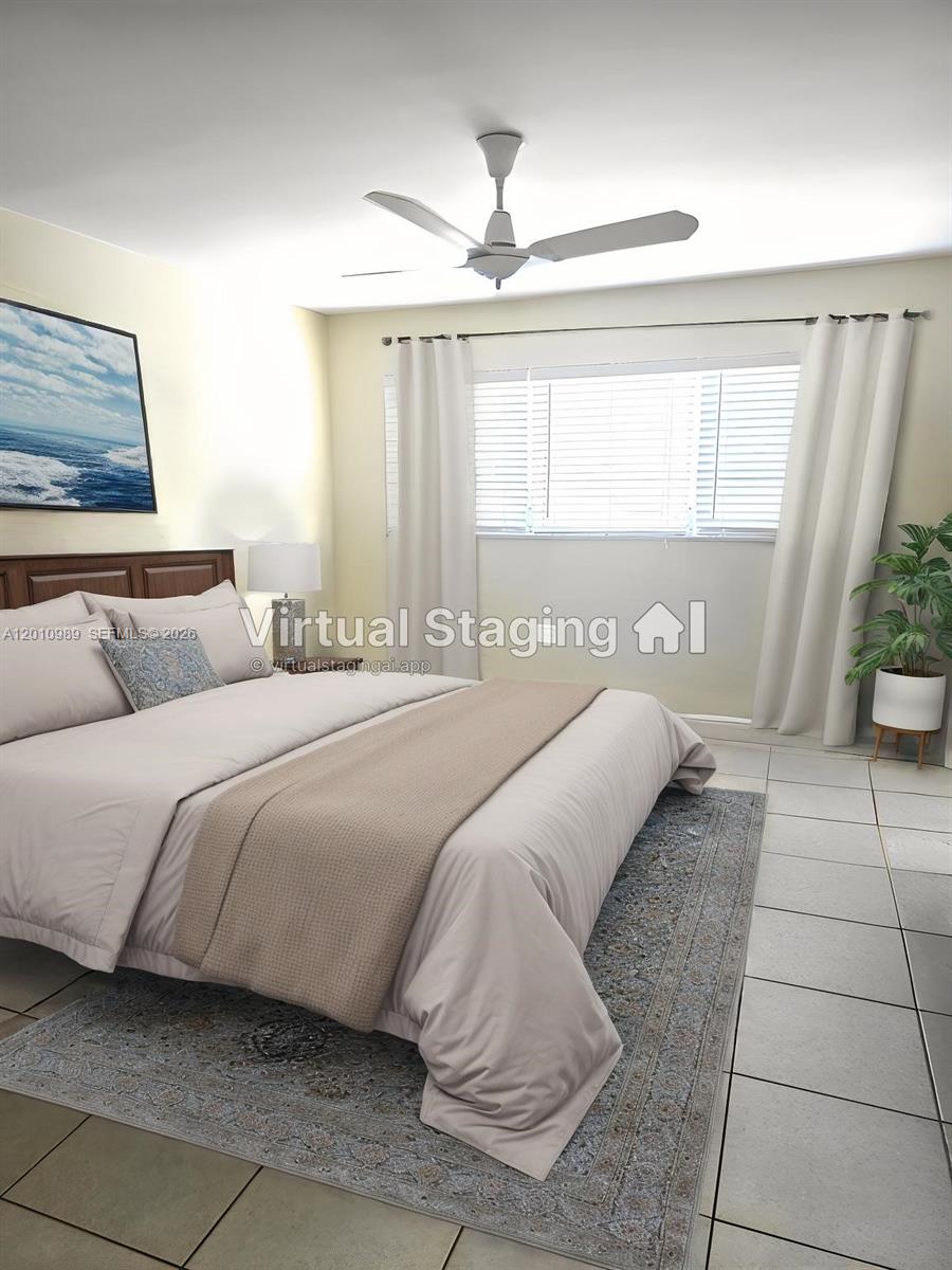 A bedroom with a bed, ceiling fan, and tiled floors features virtual staging — 2097 S Ocean Dr # 305, Hallandale Beach FL 33009, HALLANDALE BEACH, FL