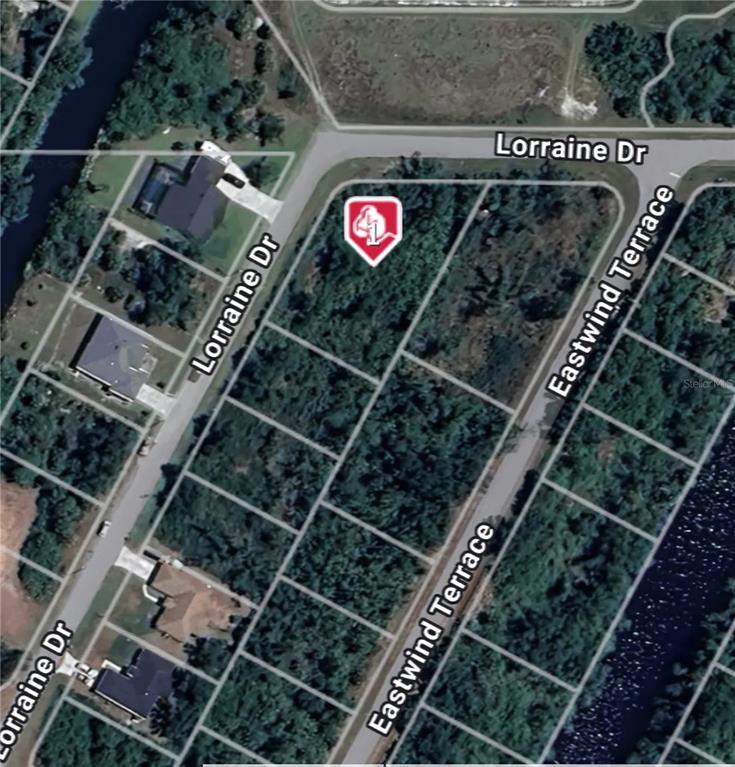 This is an aerial map view of a vacant residential lot located at a street corner — 2120 LORRAINE DRIVE, PORT CHARLOTTE, FL