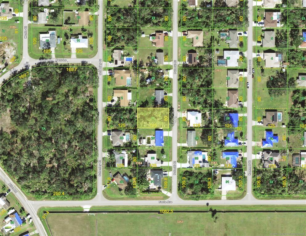 This is an aerial map showing residential lots and streets in a suburban neighborhood — 1525 PULASKI STREET, PORT CHARLOTTE, FL