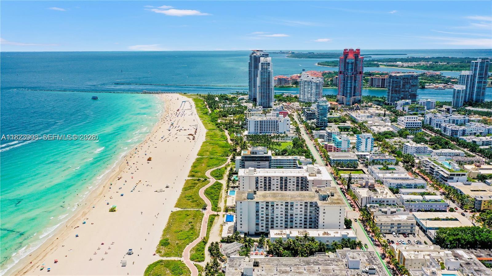 An aerial view shows a sandy beach along the ocean next to a city skyline — 401 Ocean Dr # 722, Miami Beach FL 33139, MIAMI BEACH, FL