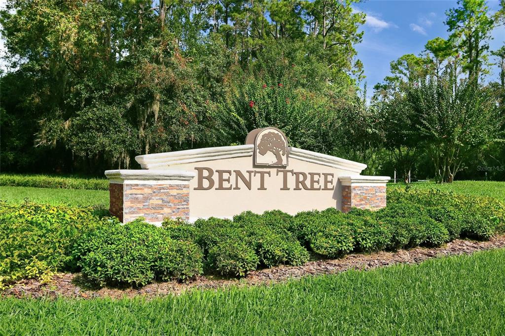 A stone and stucco monument sign for Bent Tree sits in a landscaped grassy area — 4688 OAK HOLLOW DRIVE UNIT 25, SARASOTA, FL