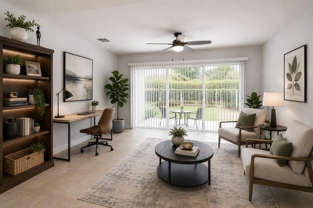 A home office with a desk, two armchairs, a coffee table, and sliding glass doors — 11844 ASTILBE DRIVE, ORLANDO, FL