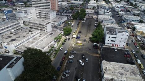An aerial view shows a commercial area with multiple buildings, parking lots, and parked cars — #541-#559 SERGIO CUEVAS BUSTAMENTE, HATO REY WARD, SAN JUAN, PR