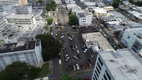 An aerial view shows a parking lot surrounded by multi-story commercial buildings and city streets — #541-#559 SERGIO CUEVAS BUSTAMENTE, HATO REY WARD, SAN JUAN, PR