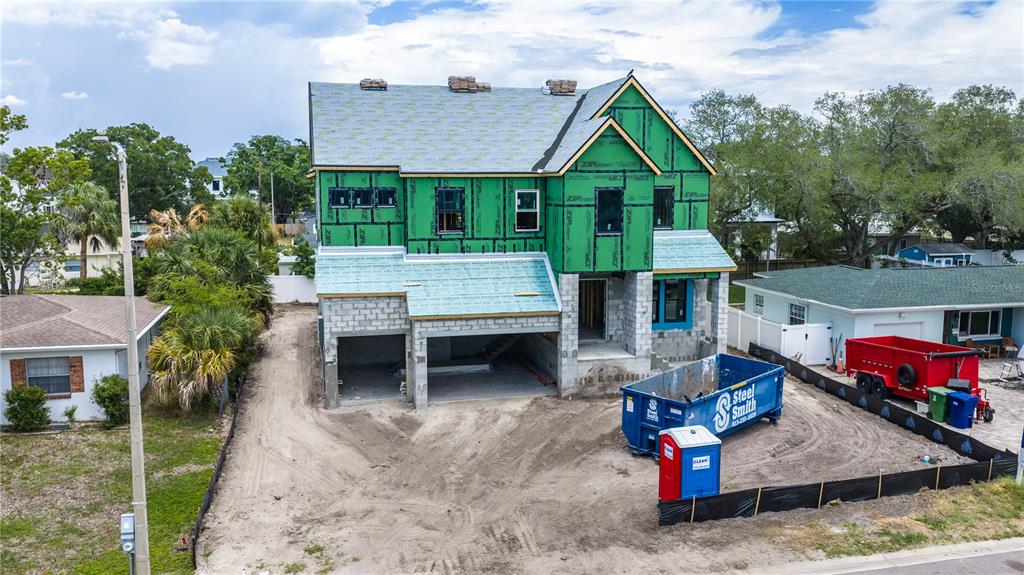 A two-story house under construction with green sheathing and a concrete block ground floor — 3606 S BELCHER DRIVE, TAMPA, FL