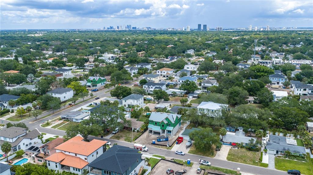 An aerial view shows a suburban neighborhood with a house under construction in the center — 3606 S BELCHER DRIVE, TAMPA, FL