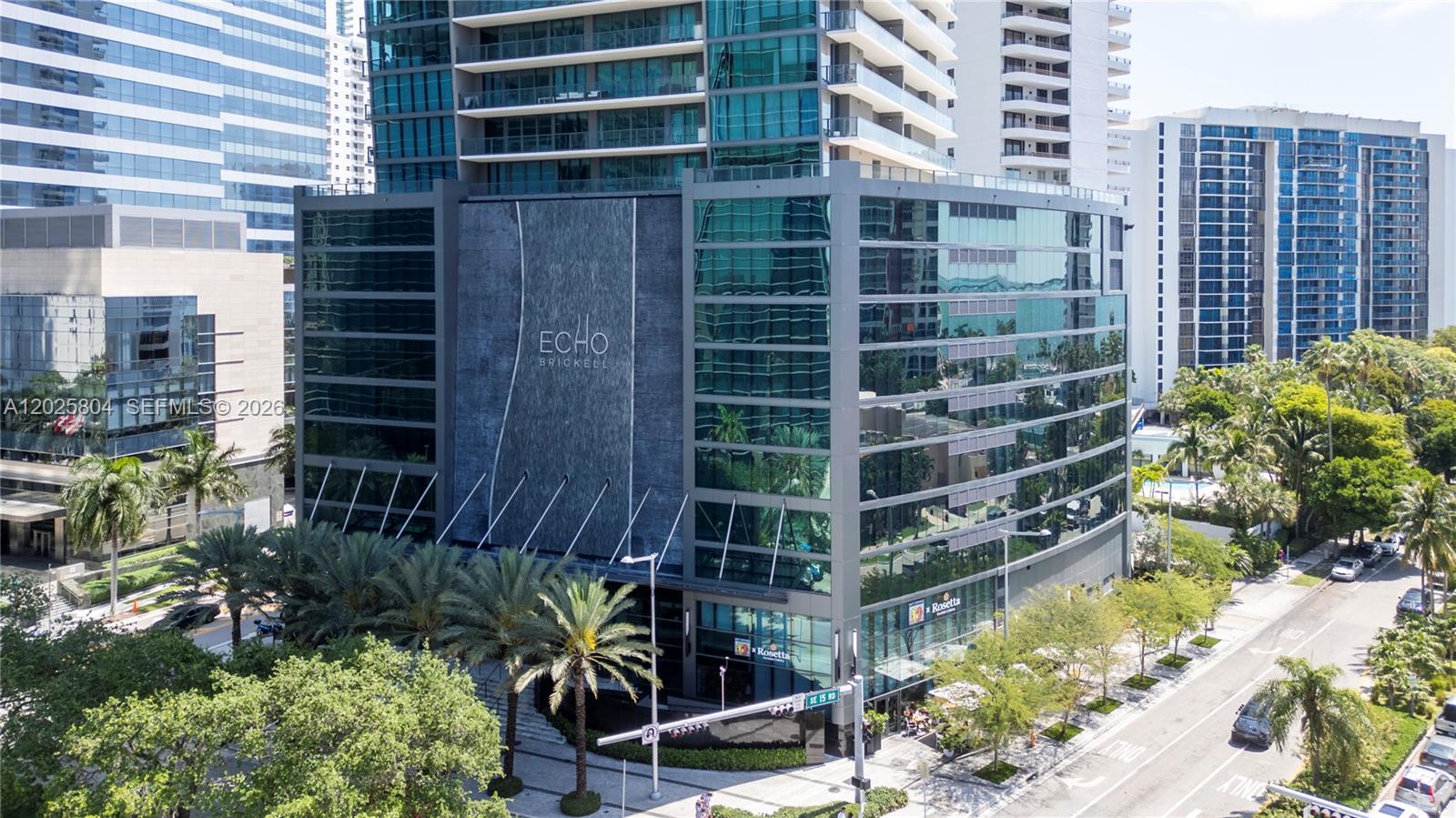 An exterior view of the Echo Brickell high-rise building featuring a dark stone facade — 1451 Brickell Ave # 2606, Miami FL 33131, MIAMI, FL