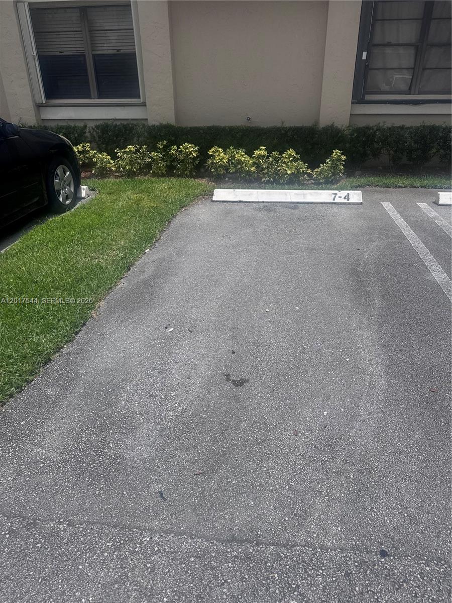 An exterior view shows a white door and a sliding glass door on a patio — 6532 NW 170th Ter, Hialeah FL 33015, HIALEAH, FL