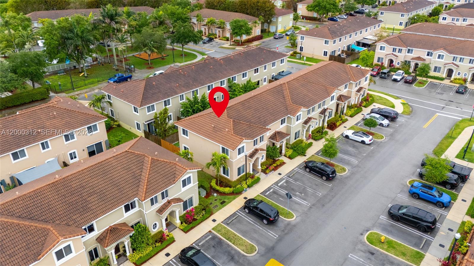 An aerial view shows a two-story townhouse complex with a red pin marking a unit — 2440 SE 10th Ct, Homestead FL 33035, HOMESTEAD, FL