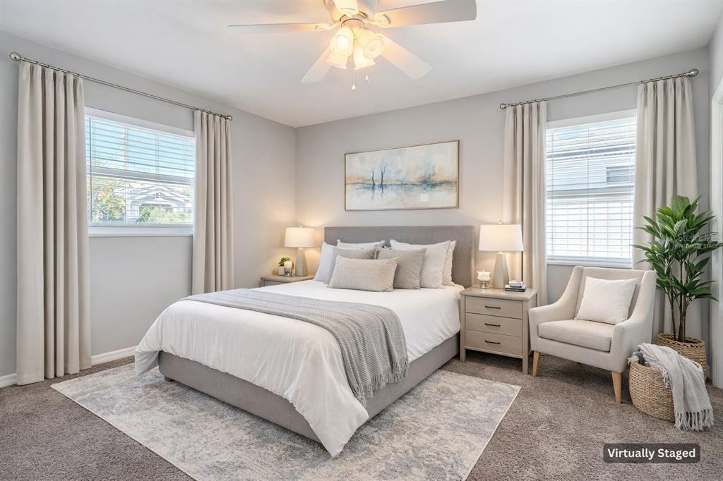 A bedroom features a queen bed, two nightstands, a chair, and a ceiling fan — 3604 W BAY TO BAY BOULEVARD, TAMPA, FL