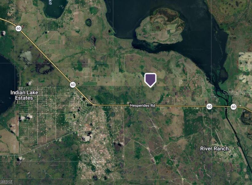 This is a satellite map showing a property location marked with a purple icon — HWY 60, LAKE WALES, FL
