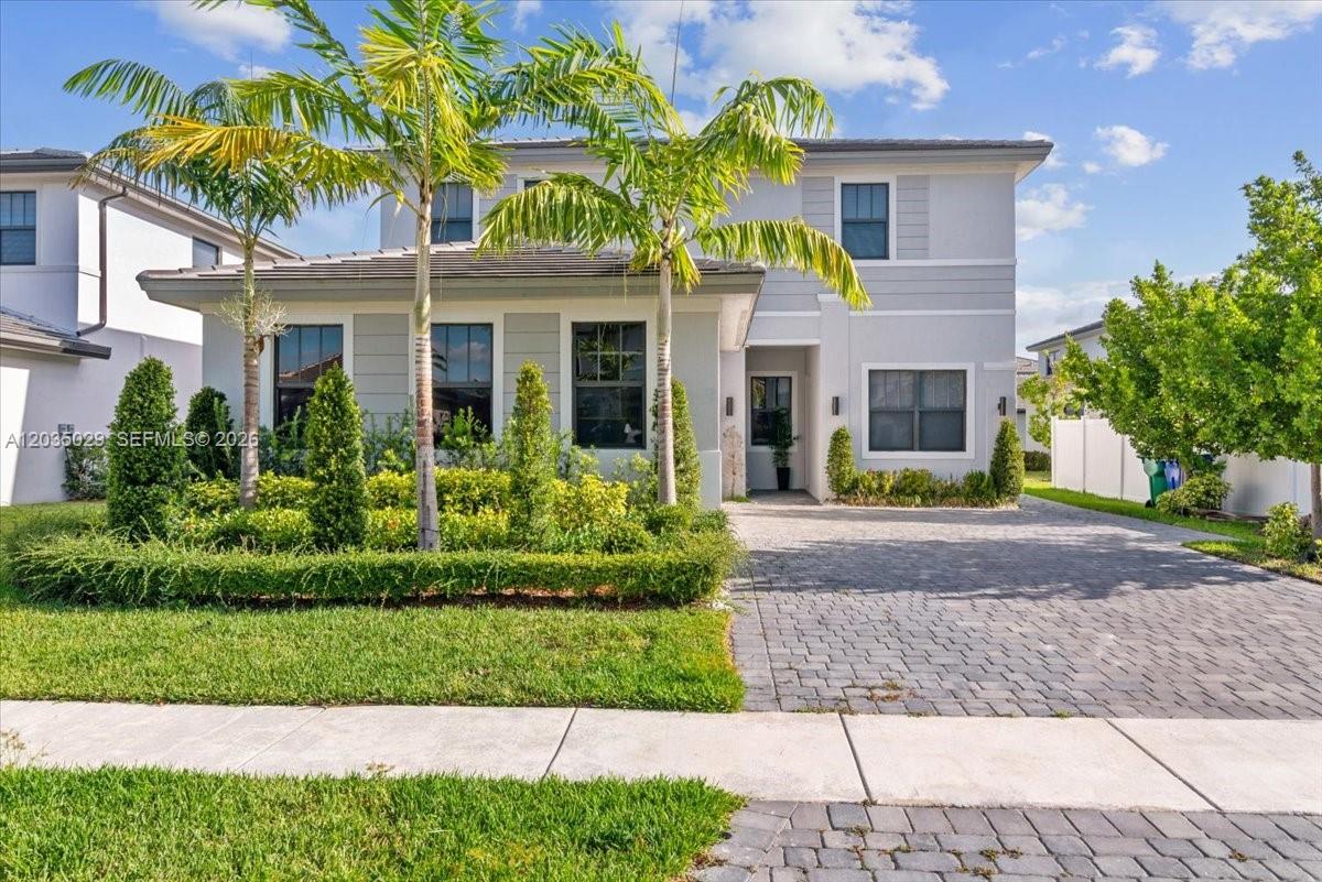 A two-story suburban house with a gray exterior, palm trees, and a paved driveway — 17333 SW 46th St, Miramar FL 33029, MIRAMAR, FL