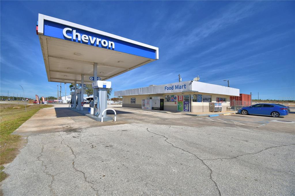A Chevron gas station with a canopy and an attached food mart building — 16311 HWY 27, LAKE WALES, FL