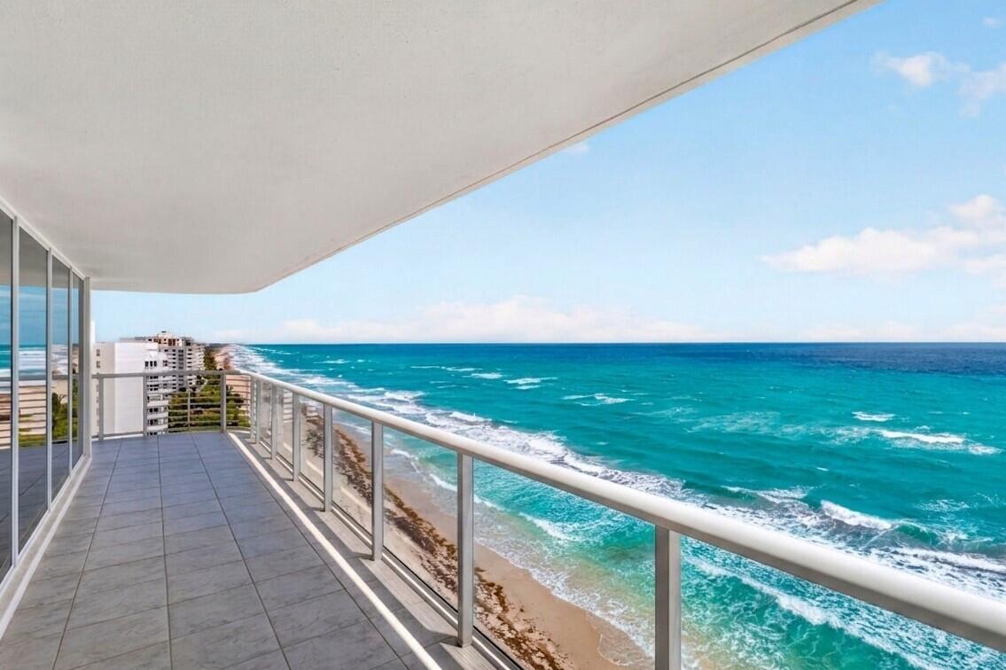 A tiled balcony overlooks a sandy beach and the turquoise ocean under a blue sky — 3505 S Ocean Boulevard # 14n, Highland Beach FL 33487, HIGHLAND BEACH, FL
