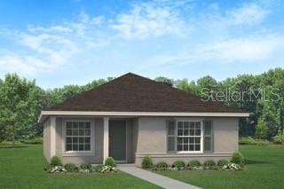 A bedroom features a tufted headboard, light blue bedding, two nightstands, and two windows — 3312 NE CAITLIN LANE, BELL, FL