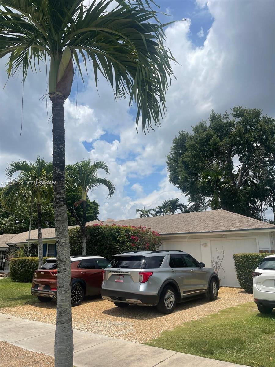 A single-story house with a gravel driveway and three parked cars under palm trees — 3531 SW 13th St # A, Miami FL 33145, MIAMI, FL