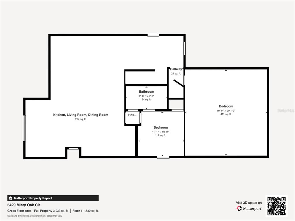 A two-story house with a tan stucco exterior, a brick driveway, and a two-car garage — 5429 MISTY OAK CIRCLE, DAVENPORT, FL