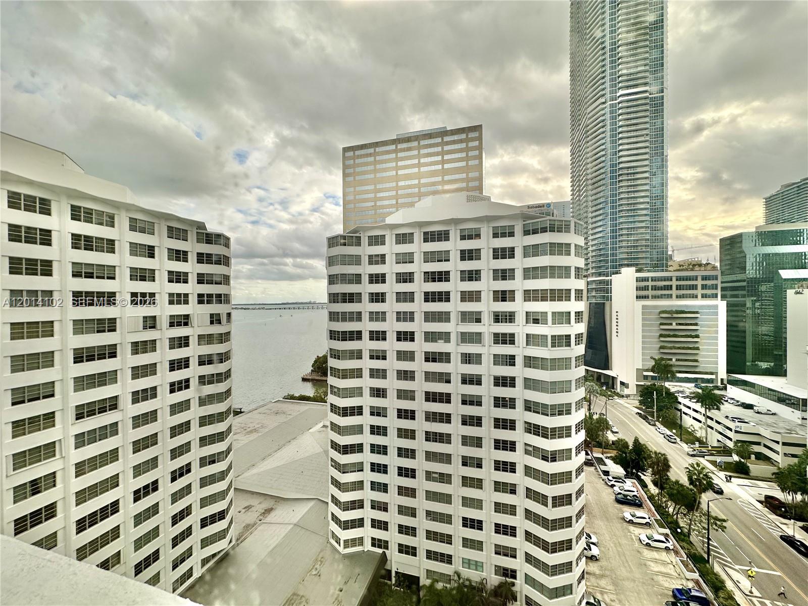 An elevated view shows several high-rise buildings and a parking lot near a body of water — 825 Brickell Bay Dr # 1751, Miami FL 33131, MIAMI, FL