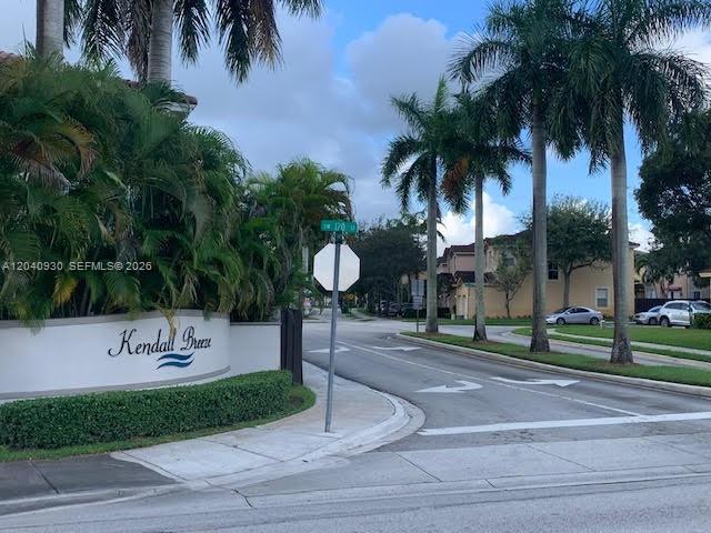 A street-level view shows the Kendall Breeze community entrance sign surrounded by palm trees — 12361 SW 123rd Ter, Miami FL 33186, MIAMI, FL