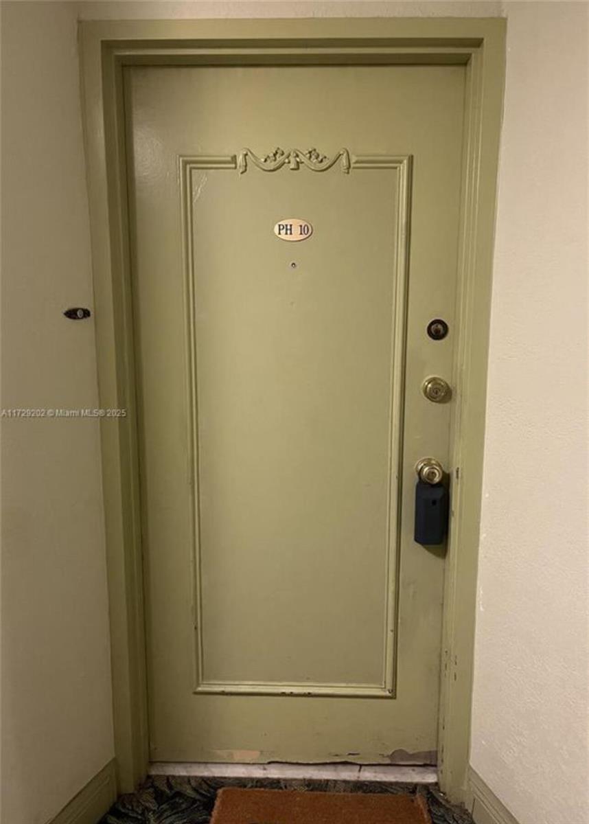 A light green door labeled PH 10 features a deadbolt, handle, and electronic lockbox — 11930 N Bayshore Drive, North Miami FL 33181, NORTH MIAMI, FL