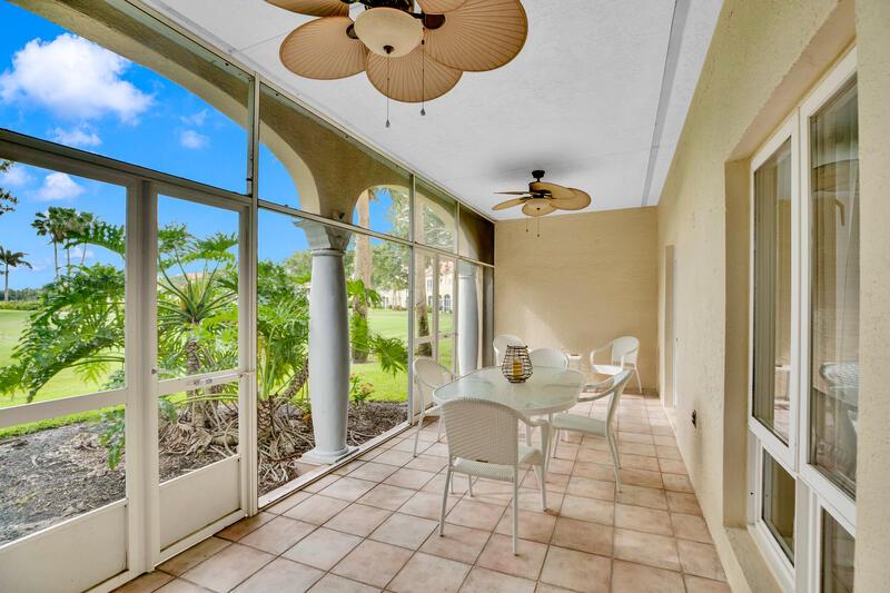 A screened-in patio features a dining set, tile flooring, ceiling fans, and golf course views — VERO BEACH, FL
