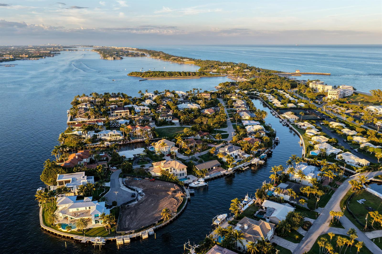 Aerial view of a coastal inlet with a bridge, parking lot, and surrounding residential area — 92 Island Drive S, Ocean Ridge FL 33435, OCEAN RIDGE, FL