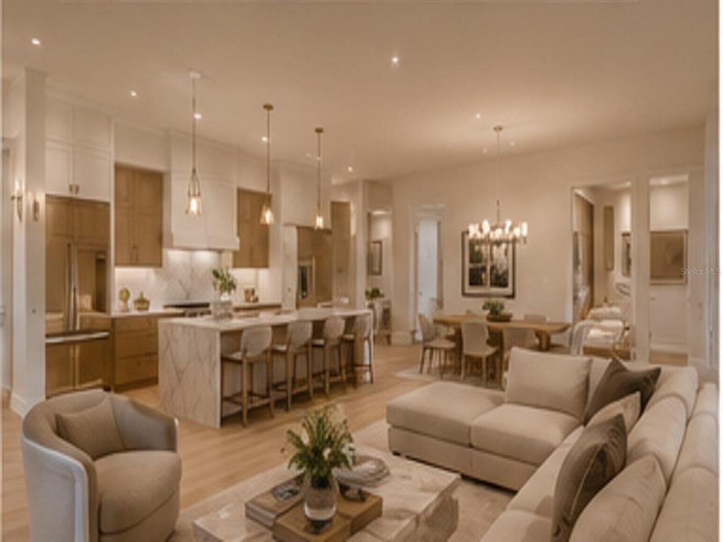 An open-concept living area features a kitchen with a marble island and a dining space — 15148 INGRAHAM BOULEVARD, PORT CHARLOTTE, FL