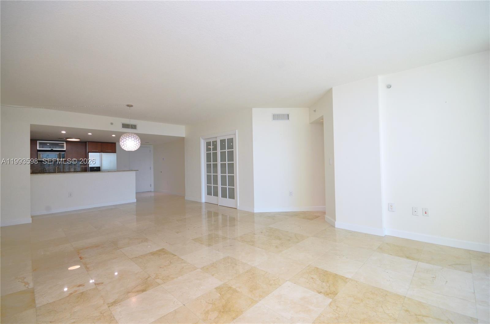 A kitchen features wood cabinets, granite countertops, stainless steel appliances, and a double sink — 9055 SW 73rd Ct # 1106, Miami FL 33156, MIAMI, FL