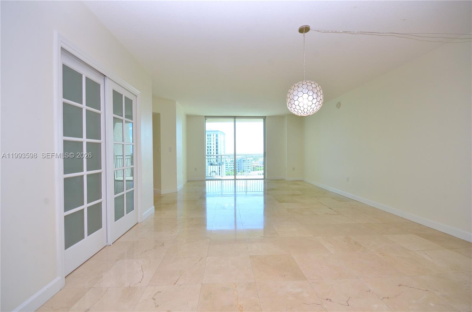 A dining area and living room feature tile floors, modern furniture, and floor-to-ceiling windows — 9055 SW 73rd Ct # 1106, Miami FL 33156, MIAMI, FL