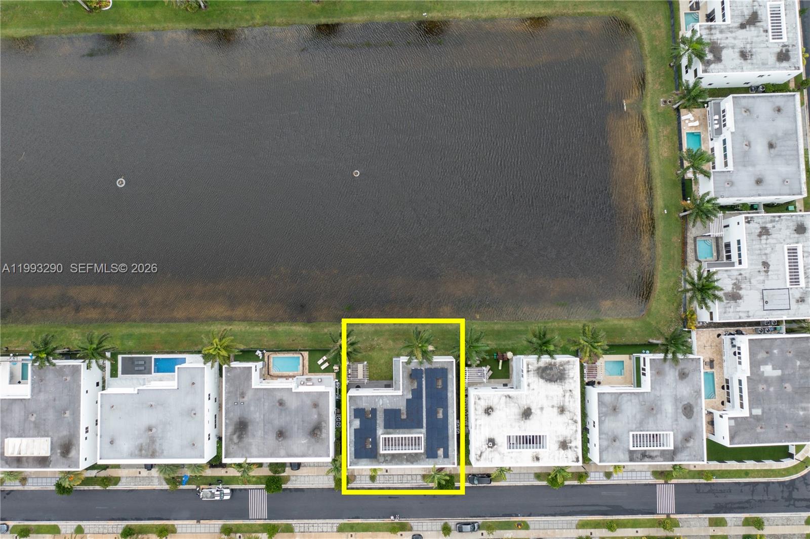 An aerial view shows a row of townhouses with a highlighted unit facing a lake — 10272 NW 75th Ter, Doral FL 33178, DORAL, FL