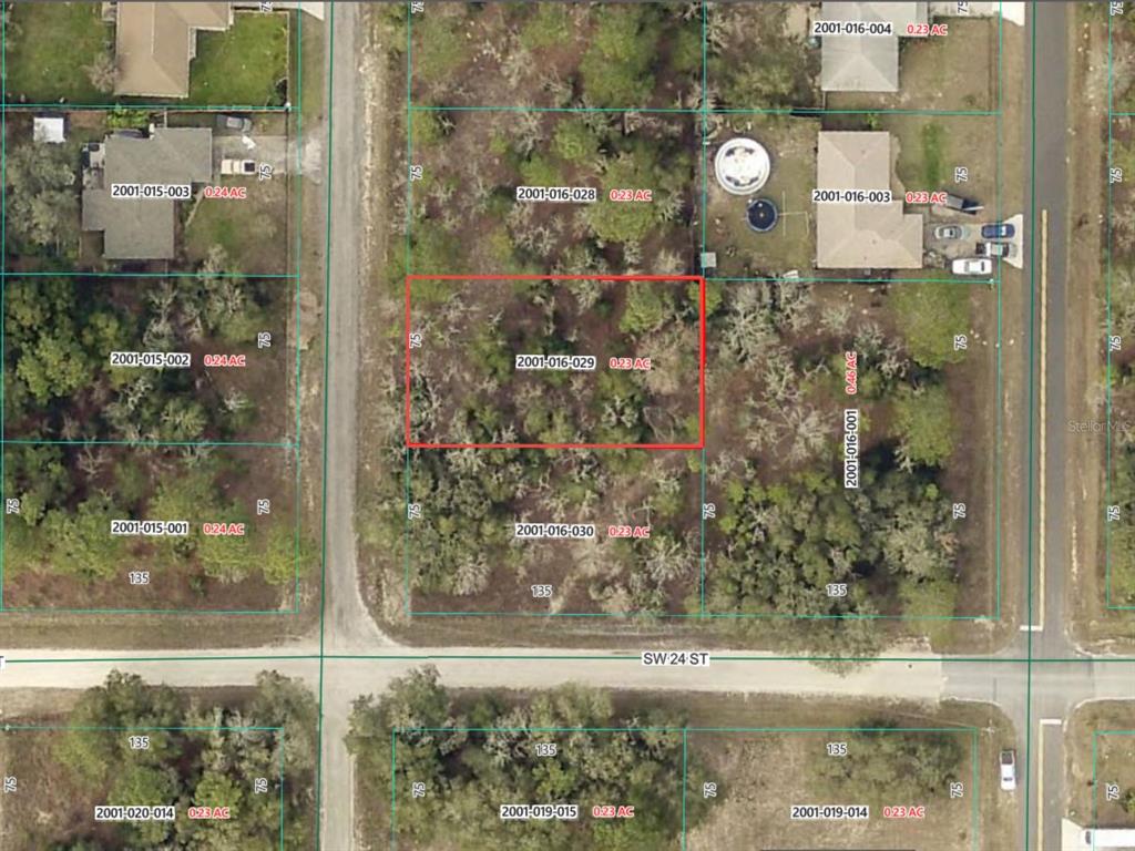 This is a satellite map showing a vacant residential lot outlined in red — SW 141ST COURT, OCALA, FL