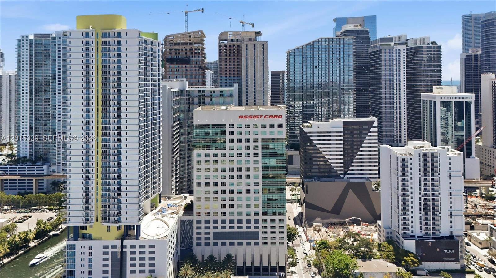 An aerial view of a dense urban skyline featuring numerous high-rise residential and commercial buildings — 175 SW 7th St # 1614, Miami FL 33130, MIAMI, FL