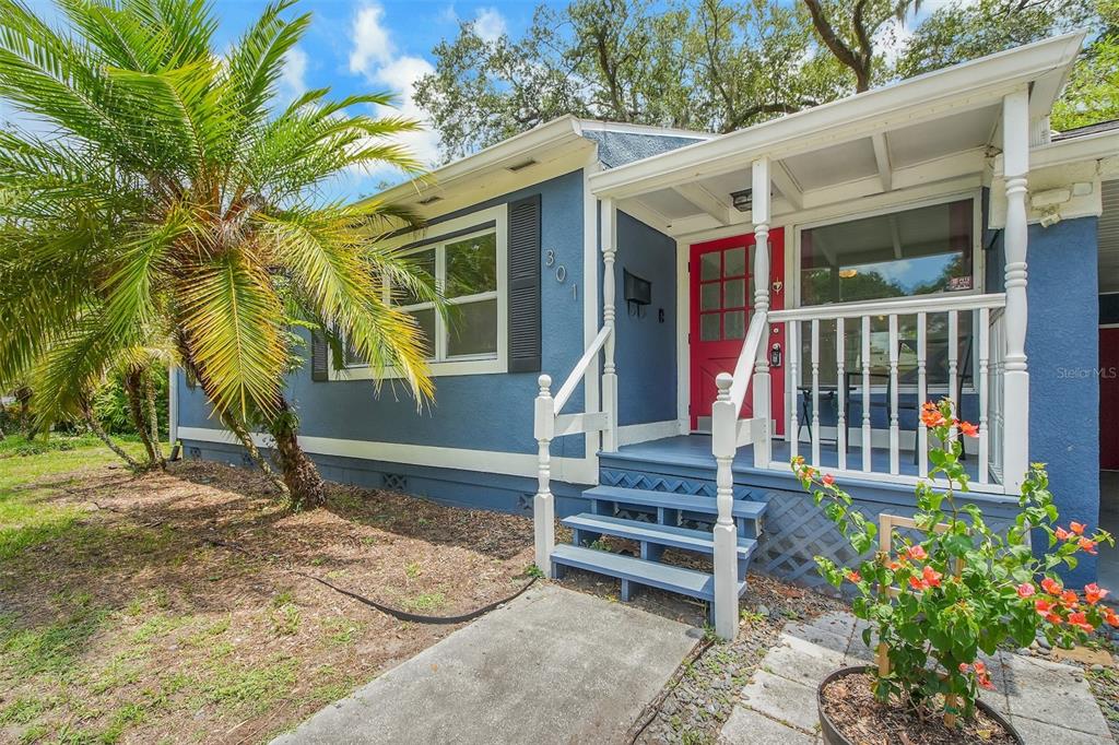 A blue house with a red front door, a small porch, and a palm tree — 301 S HAMPTON AVENUE, ORLANDO, FL