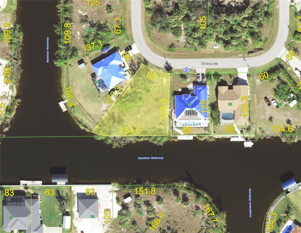 This is an aerial map showing residential lots along a waterway — 9588 NASTRAND CIRCLE, PORT CHARLOTTE, FL