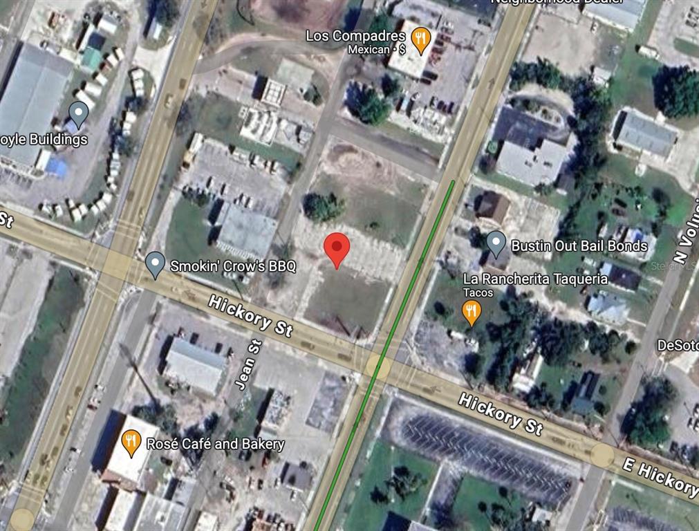 This is an aerial map view showing a vacant lot marked with a red pin — 103 N BREVARD AVENUE, ARCADIA, FL