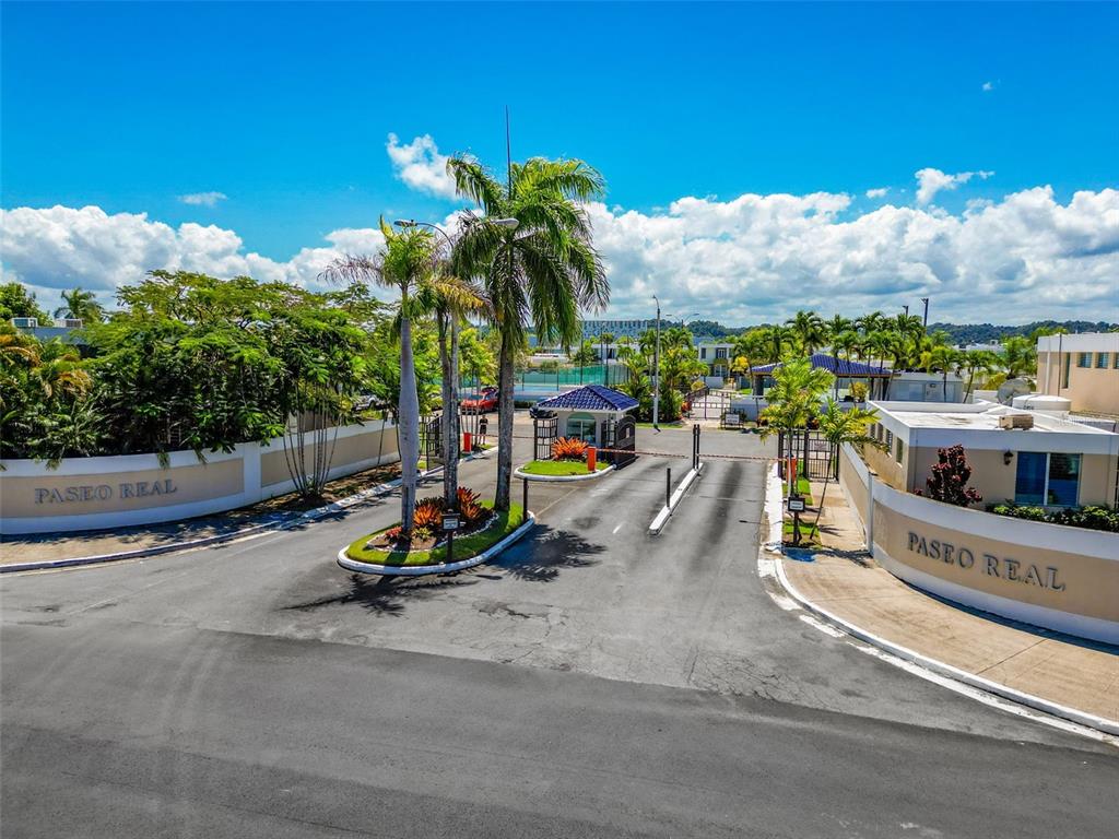 An exterior view of the gated entrance to the Paseo Real residential community — D-44 CALLE AMATISTA, DORADO, PR