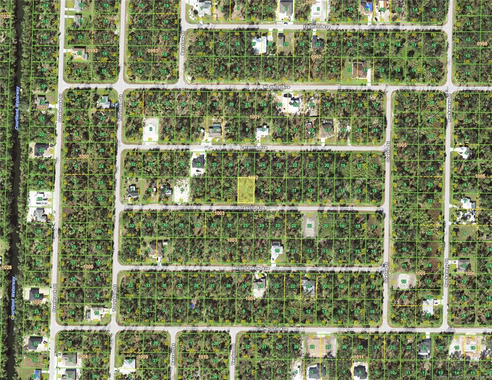 This is an aerial map showing residential lots and streets in a wooded neighborhood — 18356 DAKOTA AVENUE, PORT CHARLOTTE, FL