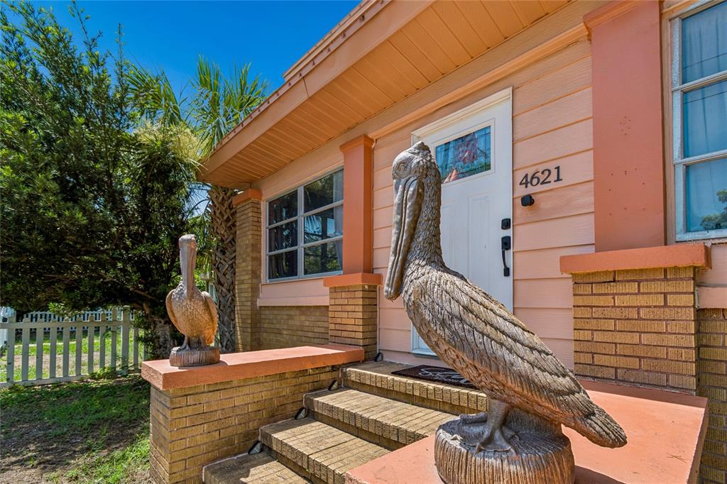 An aerial view shows a house with a gray roof, a pool, and a backyard patio — 4621 9TH AVENUE N, ST PETERSBURG, FL