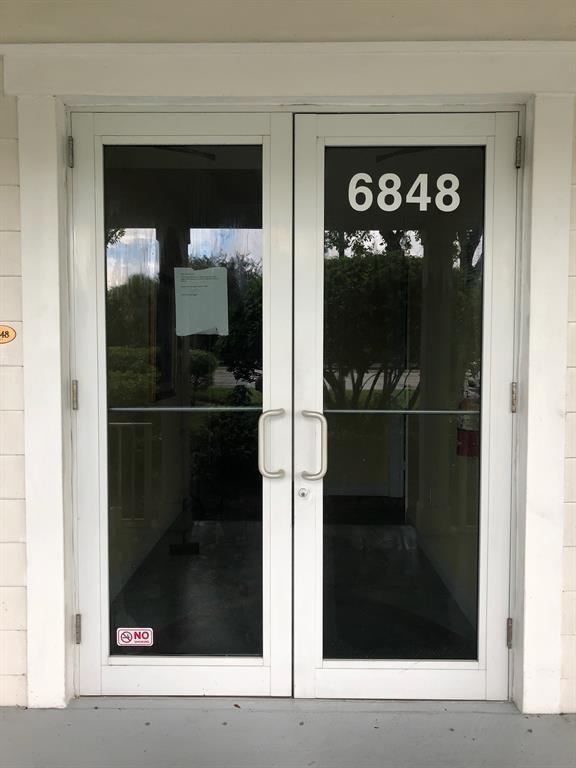 A set of double glass doors with white frames and the number 6848 displayed above — 6848 Griffin Road # 6, Davie FL 33314, DAVIE, FL