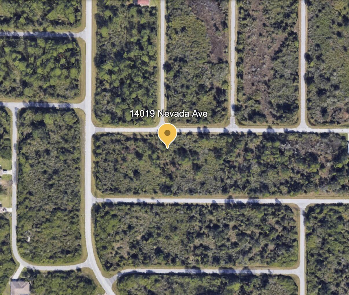 This is an aerial map view of a vacant, wooded residential lot — 14019 Nevada Avenue, FL 33953, FL