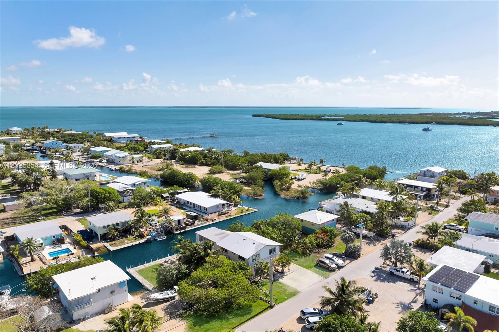 An aerial view shows waterfront homes with private docks along a canal in the Florida Keys — BIG PINE, FL