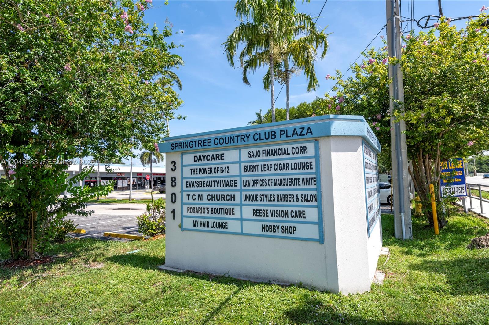 A directory sign for Springtree Country Club Plaza stands in front of a commercial building — 3801 N University Dr # 320, Sunrise FL 33351, SUNRISE, FL