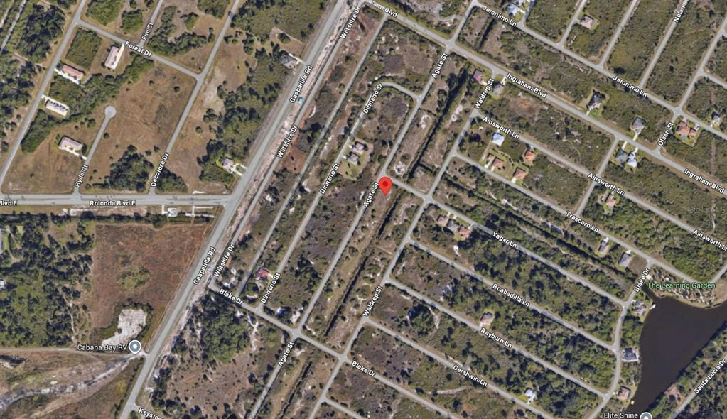 This is an aerial map view of a residential neighborhood with undeveloped lots and roads — 8518 AGATE STREET, PORT CHARLOTTE, FL